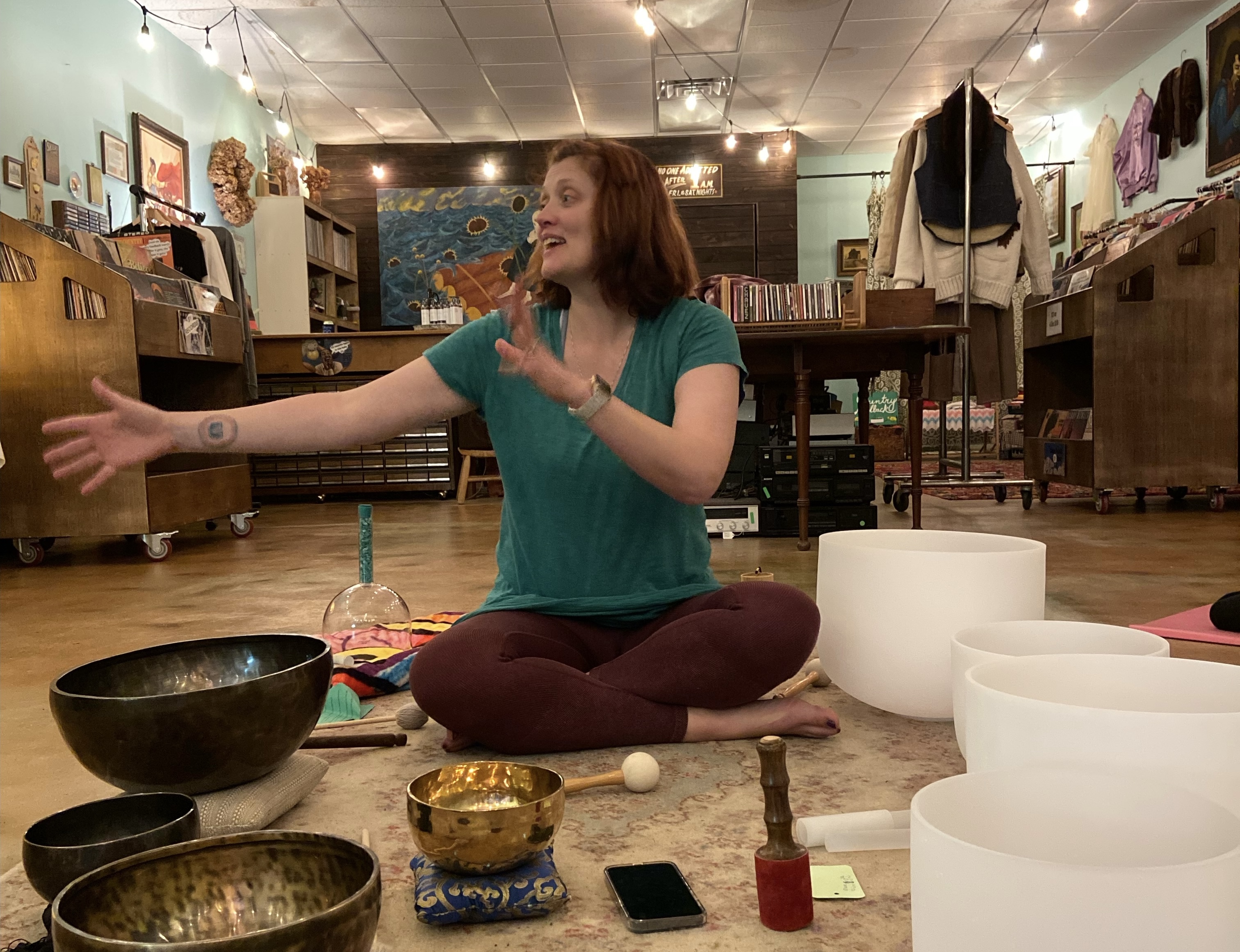 Carli Webb leading a sound session, surrounded by bowls